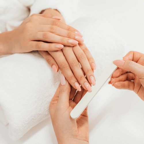 9066b13b healthy beautiful manicure manicurist with file 1.png